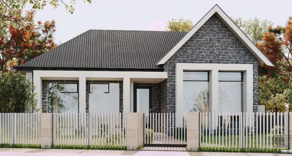 Contemporary single-story home with a stone façade, pitched roof, and white picket fence.