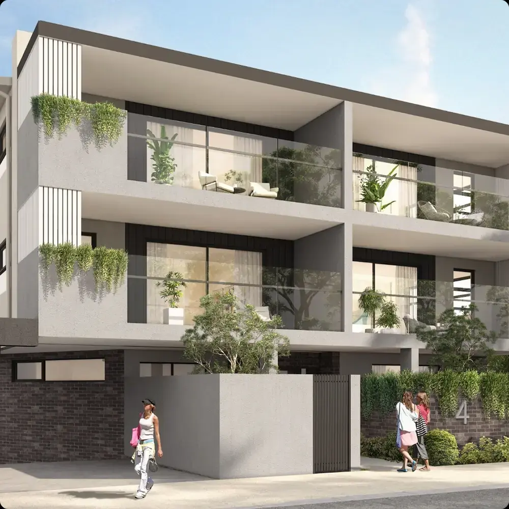 Contemporary three-story apartment building with balconies, landscaped frontage, and covered parking.